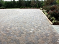paver parking court with cobble edging
