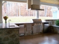 covered outdoor kitchen and entertaining space