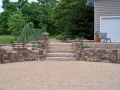 fieldstone retaining wall with stone slab stairs