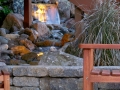 small water feature enhancing wasted space under deck stairs