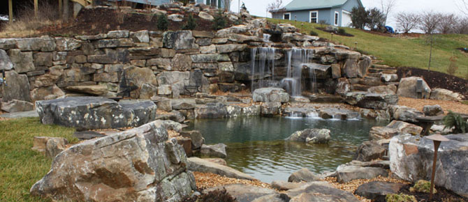 natural swim pond with 8' water falls
